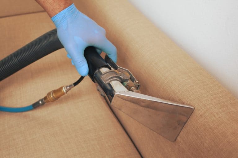 a man cleaning upholstery in hamilton